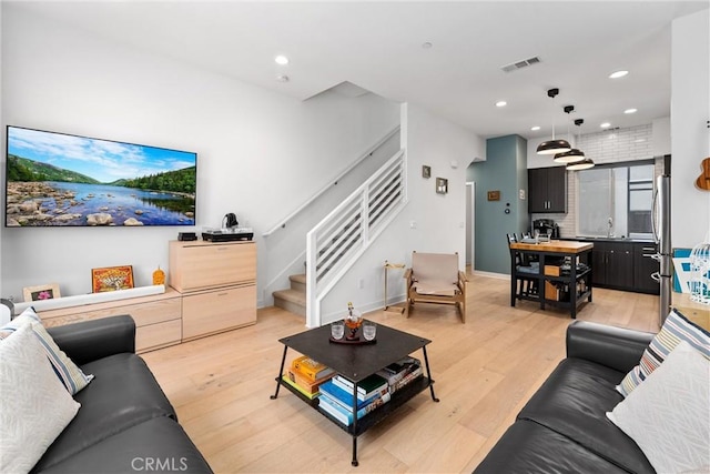 206 Alamo Ct, Long Beach, CA 90802 - living room with stairs, light wood-style flooring, and recessed lighting