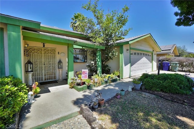 1200 Oxford Way, Hanford, CA 93230 - view of front facade featuring an attached garage and stucco siding