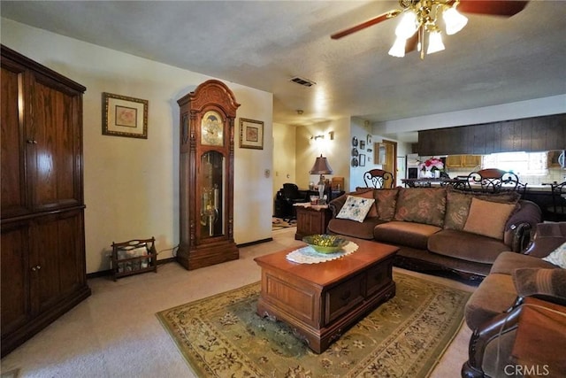 1200 Oxford Way, Hanford, CA 93230 - living room featuring a ceiling fan and light colored carpet