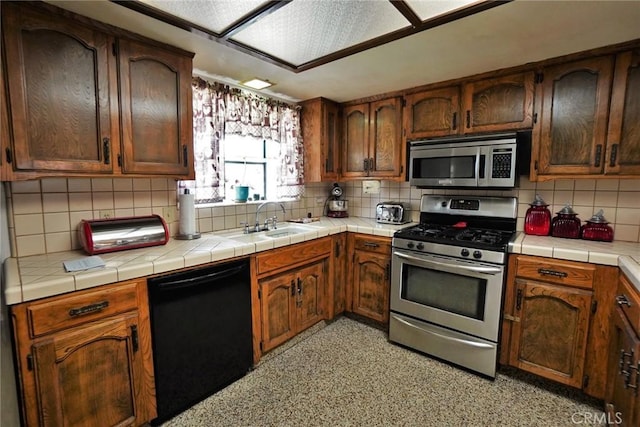 1200 Oxford Way, Hanford, CA 93230 - kitchen featuring stainless steel appliances and decorative backsplash