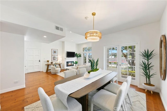 1114 Vincent St Unit A, Redondo Beach, CA 90277 - dining room with light wood finished floors, a glass covered fireplace, and recessed lighting