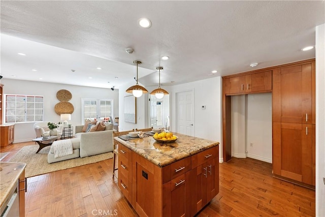 1114 Vincent St Unit A, Redondo Beach, CA 90277 - kitchen featuring light wood-style floors, recessed lighting, hanging light fixtures, light stone countertops, and open floor plan