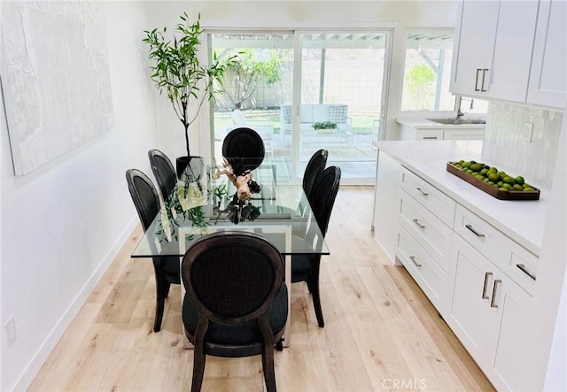 11143 Gonsalves Pl, Cerritos, CA 90703 - dining room with light wood finished floors and baseboards