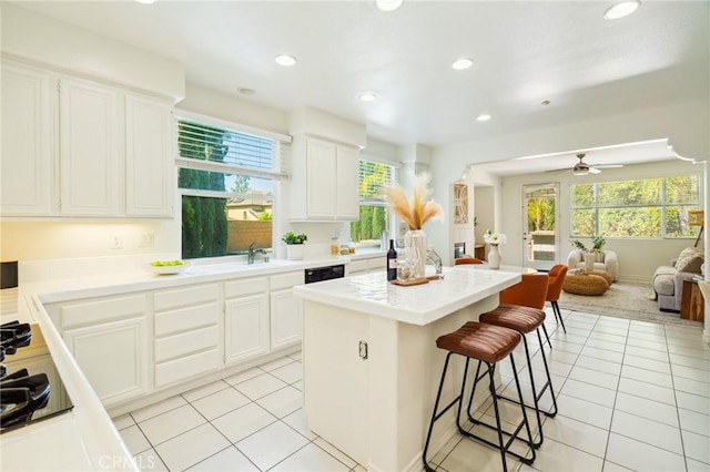 501 Newman Cir, Placentia, CA 92870 - kitchen featuring open floor plan, a breakfast bar area, light tile patterned flooring, a center island, and plenty of natural light