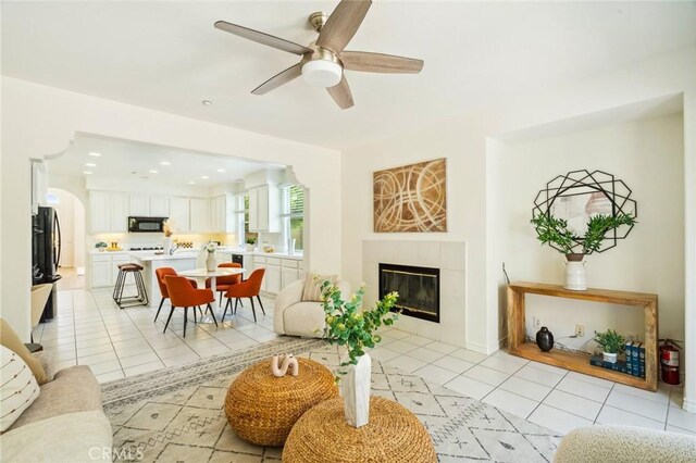 501 Newman Cir, Placentia, CA 92870 - living area featuring light tile patterned floors, a tile fireplace, a ceiling fan, and recessed lighting