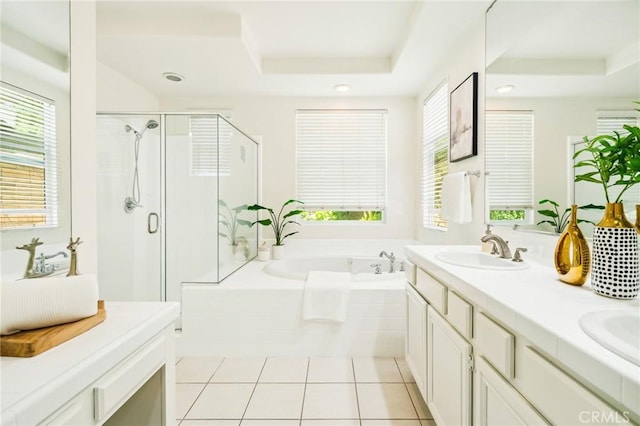 501 Newman Cir, Placentia, CA 92870 - full bath with a tray ceiling, a garden tub, double vanity, a shower stall, and plenty of natural light