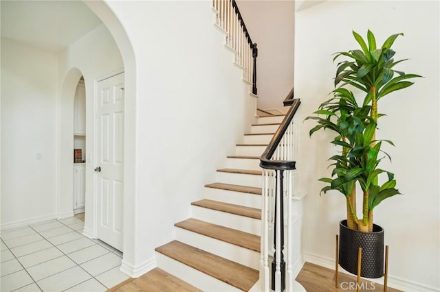 501 Newman Cir, Placentia, CA 92870 - staircase with arched walkways and baseboards