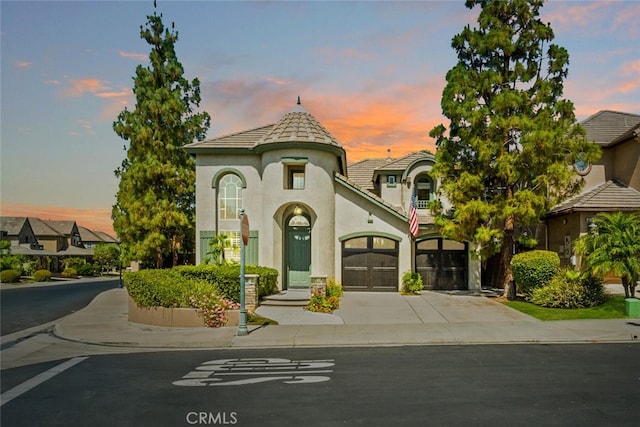 501 Newman Cir, Placentia, CA 92870 - view of front facade with concrete driveway, stucco siding, a garage, and a tile roof