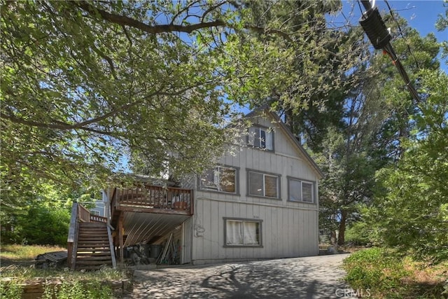 316 La Casita Dr, Twin Peaks, CA 92391 - view of front facade with stairway and a wooden deck