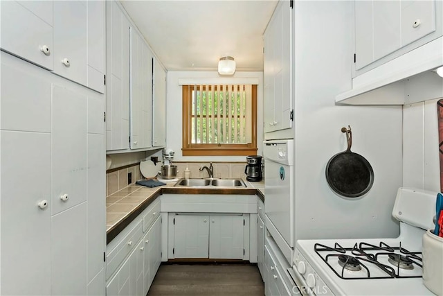 316 La Casita Dr, Twin Peaks, CA 92391 - kitchen with white gas range, tile countertops, white cabinets, and dark wood-style flooring