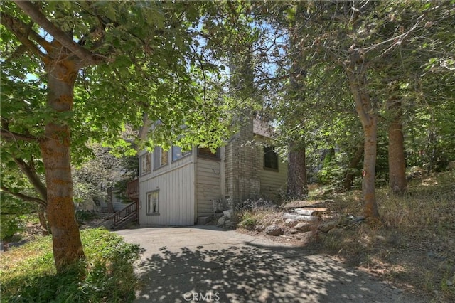 316 La Casita Dr, Twin Peaks, CA 92391 - view of home's exterior featuring a patio area and stairway