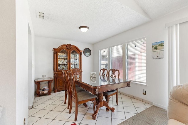 4068 De La Vina Way, Sacramento, CA 95823 - dining room featuring a textured ceiling and light tile patterned flooring