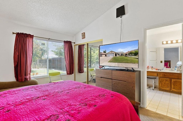 4068 De La Vina Way, Sacramento, CA 95823 - bedroom with vaulted ceiling, a textured ceiling, light tile patterned floors, ensuite bath, and a closet