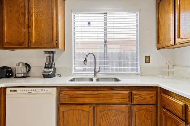 4068 De La Vina Way, Sacramento, CA 95823 - kitchen featuring white dishwasher, light countertops, and brown cabinetry