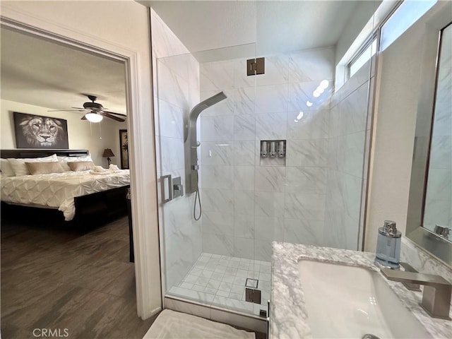 9830 Mesquite Ave, Desert Hot Springs, CA 92240 - ensuite bathroom with a stall shower, vanity, a ceiling fan, and wood finished floors