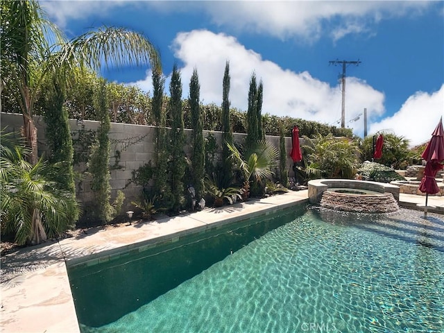9830 Mesquite Ave, Desert Hot Springs, CA 92240 - view of pool with a fenced backyard and a pool with connected hot tub