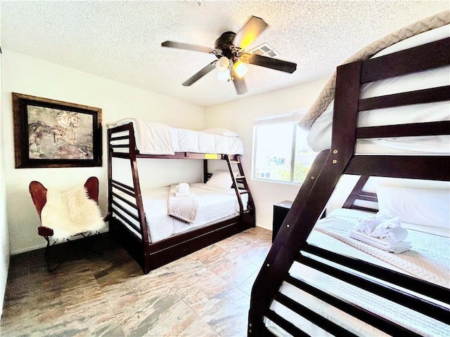 9830 Mesquite Ave, Desert Hot Springs, CA 92240 - bedroom featuring a textured ceiling and a ceiling fan