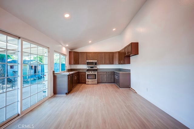 9063 Rosecrest Ln, Fontana, CA 92335 - kitchen featuring appliances with stainless steel finishes, light wood-style floors, light countertops, recessed lighting, and brown cabinets