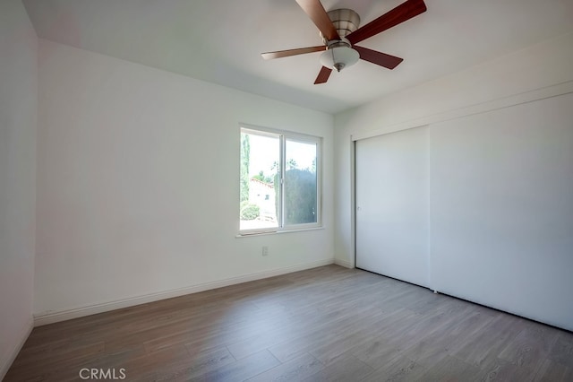 9063 Rosecrest Ln, Fontana, CA 92335 - empty room with wood finished floors and a ceiling fan