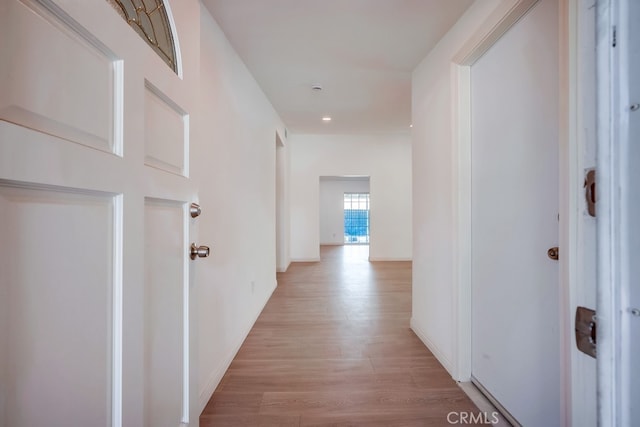 9063 Rosecrest Ln, Fontana, CA 92335 - corridor with light wood-style floors and recessed lighting