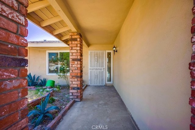 9063 Rosecrest Ln, Fontana, CA 92335 - doorway to property with stucco siding