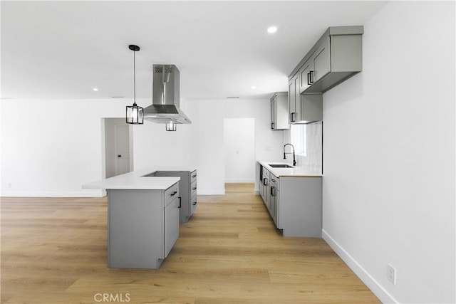 1736 N Mcdivitt Ave, Compton, CA 90221 - kitchen with range hood, gray cabinetry, light countertops, and recessed lighting