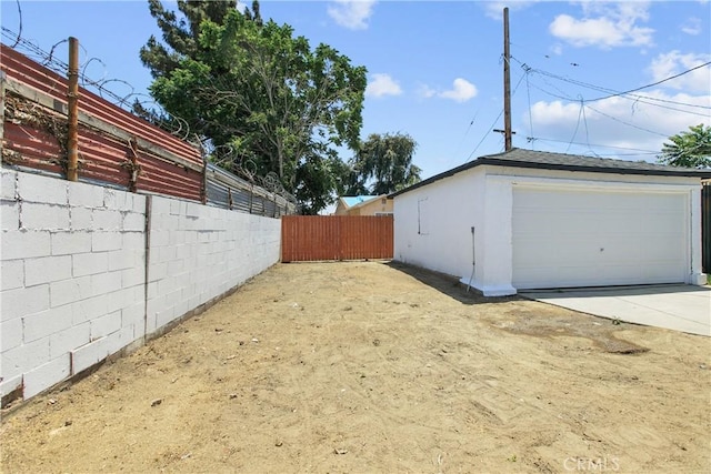 1736 N Mcdivitt Ave, Compton, CA 90221 - view of yard with a garage