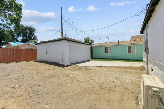1736 N Mcdivitt Ave, Compton, CA 90221 - rear view of property featuring a detached garage and an outdoor structure