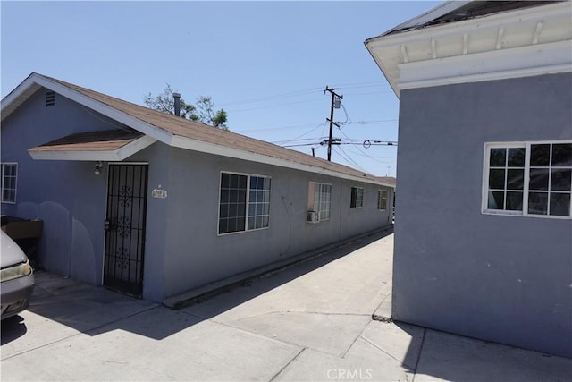 6910 Chanslor Ave, Bell, CA 90201 - view of property exterior featuring stucco siding and a patio area
