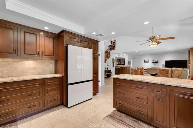 17262 Chase St, Northridge, CA 91325 - kitchen with freestanding refrigerator, ornamental molding, a ceiling fan, backsplash, and recessed lighting