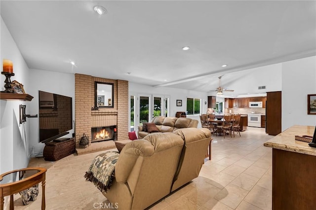17262 Chase St, Northridge, CA 91325 - living room with a fireplace, recessed lighting, a ceiling fan, and vaulted ceiling