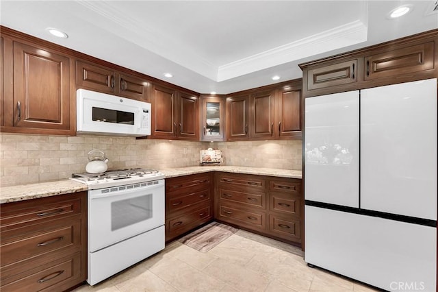 17262 Chase St, Northridge, CA 91325 - kitchen with white appliances, a tray ceiling, ornamental molding, backsplash, and recessed lighting