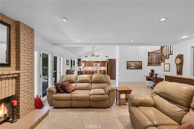 17262 Chase St, Northridge, CA 91325 - living area featuring vaulted ceiling, a ceiling fan, recessed lighting, stairs, and a brick fireplace