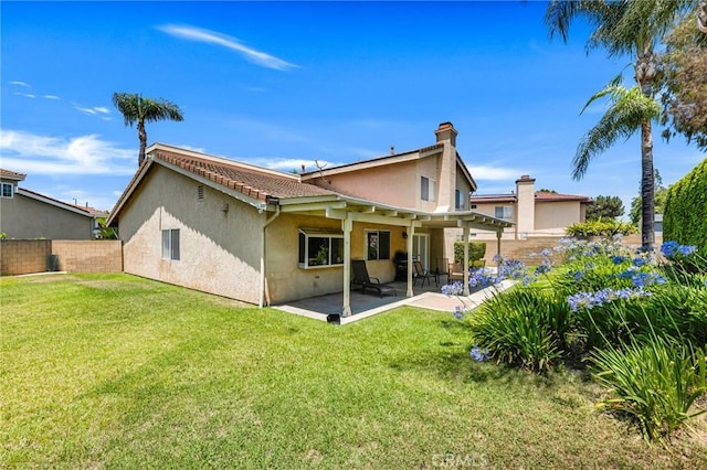 17262 Chase St, Northridge, CA 91325 - rear view of house with stucco siding, a fenced backyard, and a patio