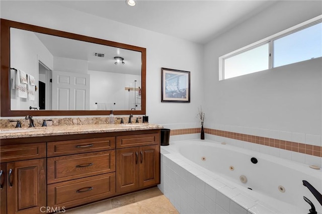 17262 Chase St, Northridge, CA 91325 - bathroom featuring a tub with jets, double vanity, and tile patterned floors