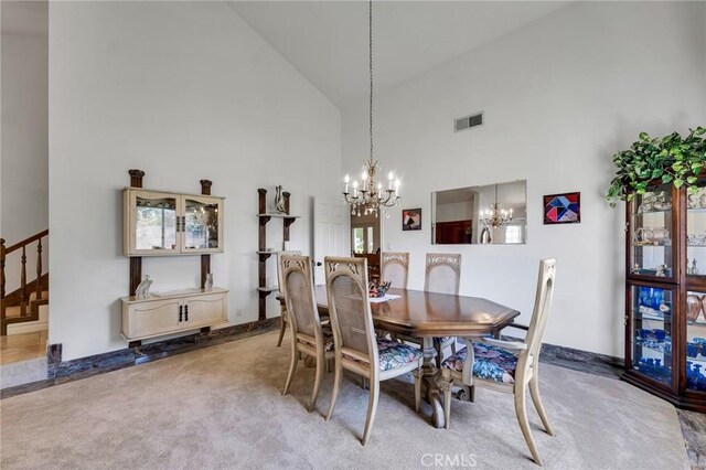 17262 Chase St, Northridge, CA 91325 - dining space featuring high vaulted ceiling, a chandelier, and carpet