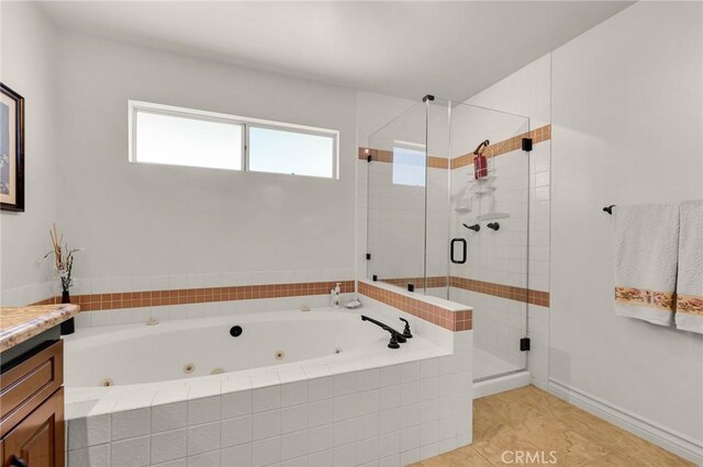 17262 Chase St, Northridge, CA 91325 - bathroom featuring a tub with jets, a stall shower, vanity, and tile patterned flooring