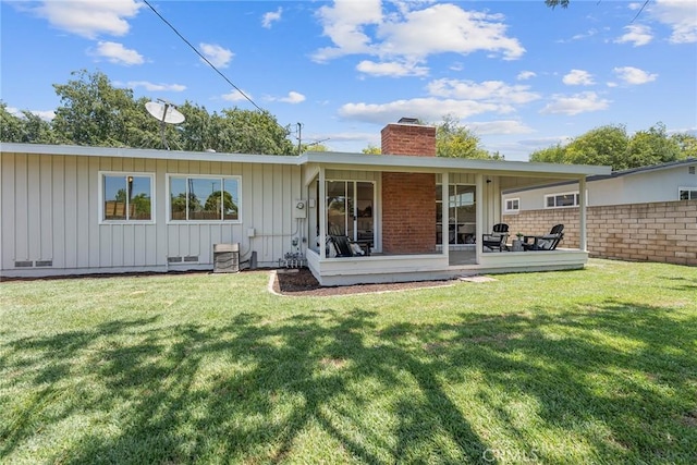 2781 Vuelta Grande Ave, Long Beach, CA 90815 - rear view of property with board and batten siding and a chimney
