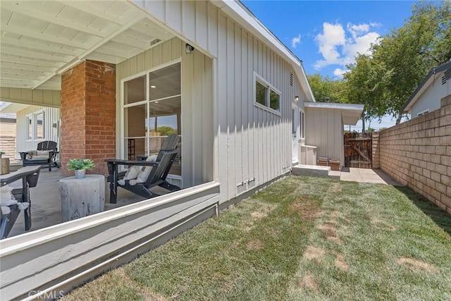 2781 Vuelta Grande Ave, Long Beach, CA 90815 - view of home's exterior with board and batten siding and a gate