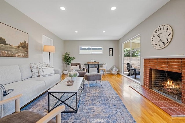 2781 Vuelta Grande Ave, Long Beach, CA 90815 - living area featuring wood finished floors, a fireplace, and recessed lighting