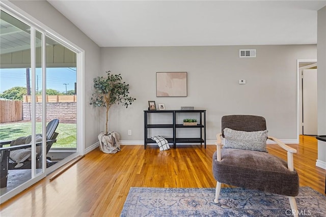 2781 Vuelta Grande Ave, Long Beach, CA 90815 - sitting room featuring healthy amount of natural light and light wood-style floors
