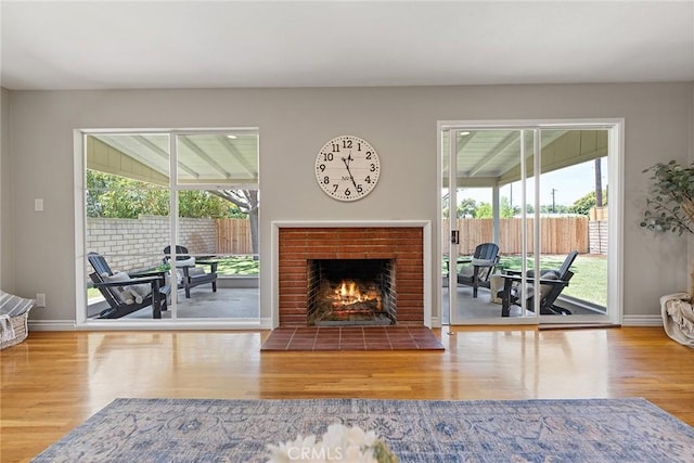 2781 Vuelta Grande Ave, Long Beach, CA 90815 - living area featuring wood finished floors and a fireplace