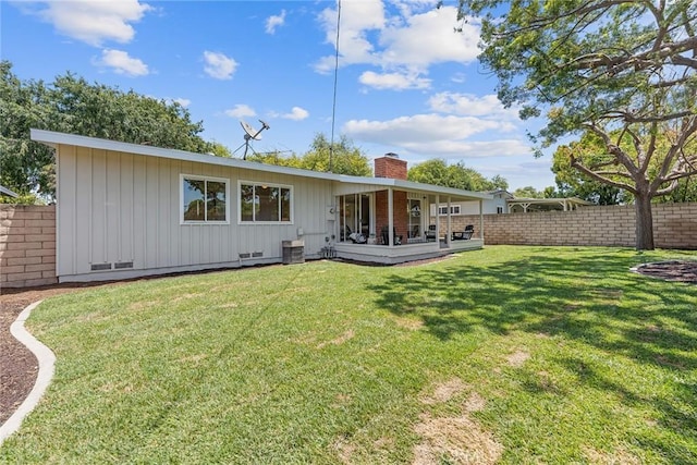 2781 Vuelta Grande Ave, Long Beach, CA 90815 - back of property with a chimney, board and batten siding, and crawl space