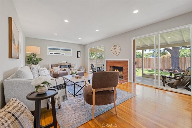 2781 Vuelta Grande Ave, Long Beach, CA 90815 - living room with wood finished floors, recessed lighting, and a fireplace