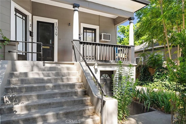 1029 Salem St, Chico, CA 95928 - view of exterior entry featuring covered porch and an AC wall unit