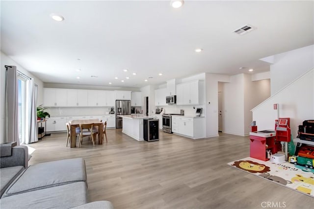 2278 Yuzu St, Corona, CA 92883 - living area with light wood finished floors, recessed lighting, and wine cooler