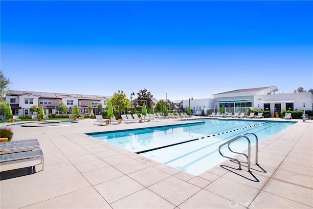 2278 Yuzu St, Corona, CA 92883 - community pool featuring a patio, a hot tub, and a residential view