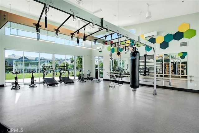 2278 Yuzu St, Corona, CA 92883 - workout area featuring a wall mounted air conditioner and a high ceiling