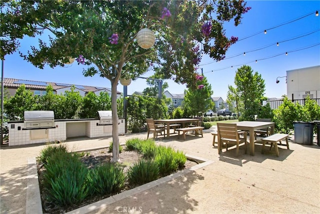 2278 Yuzu St, Corona, CA 92883 - view of patio / terrace featuring outdoor dining area, exterior kitchen, and a residential view