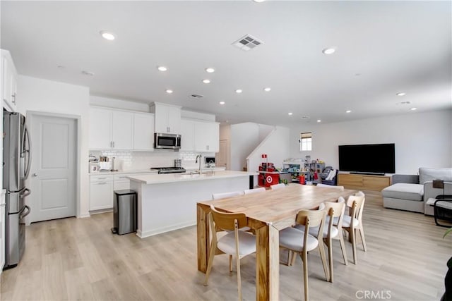 2278 Yuzu St, Corona, CA 92883 - dining area with light wood-style flooring and recessed lighting